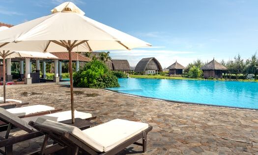 pexels-photo-14036440-14036440 Experience a tropical paradise at this luxurious resort with a stunning pool and relaxation area.