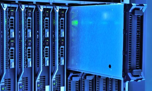 Detailed view of server racks with glowing lights in a data center environment.