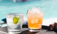 pexels-photo-36892016-36892016 Enjoy colorful poolside cocktails including a gin and tonic with lime and a fruity mocktail.